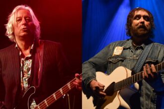 Peter Buck e Ian McNabb. Crédito: R. Diamond/C Brandon/Getty Images.