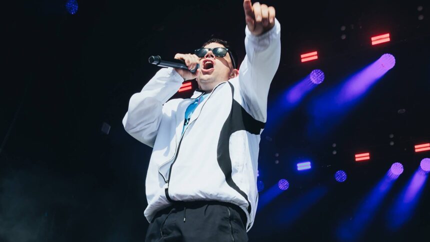 Kneecap. 's Móglaí Bap performs at Glastonbury 2025. Andy Ford for NME