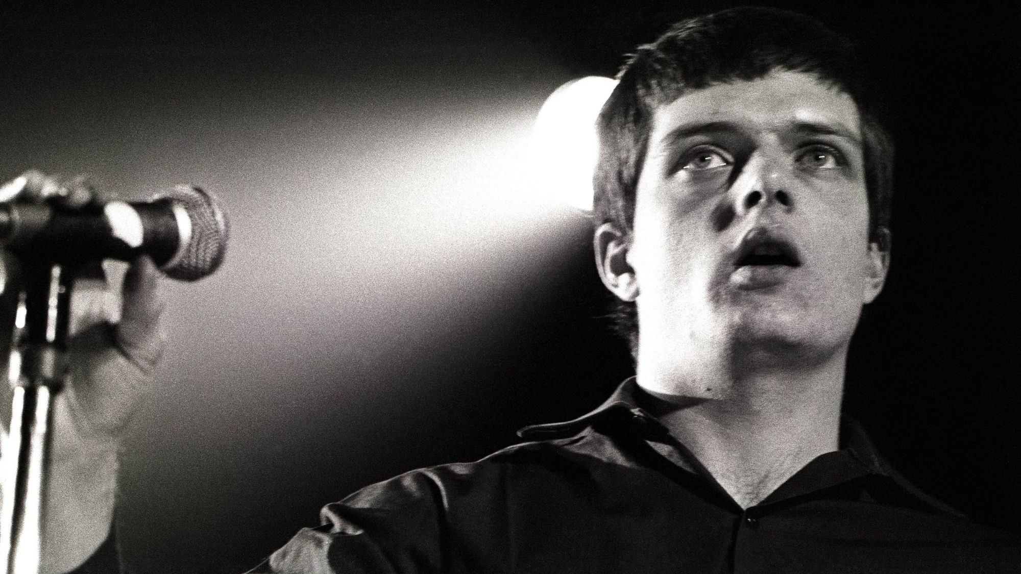 Joy Division. 's Ian Curtis performing live in 1980. Rob Verhorst/Redferns/Getty