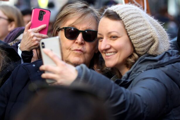 Paul McCartney. A girl takes a selfie with  during the "March For Our Lives" protest against gun violence on March 24, 2018 in New York, United States. (by Atilgan Ozdil/Anadolu Agency/Getty Images)
