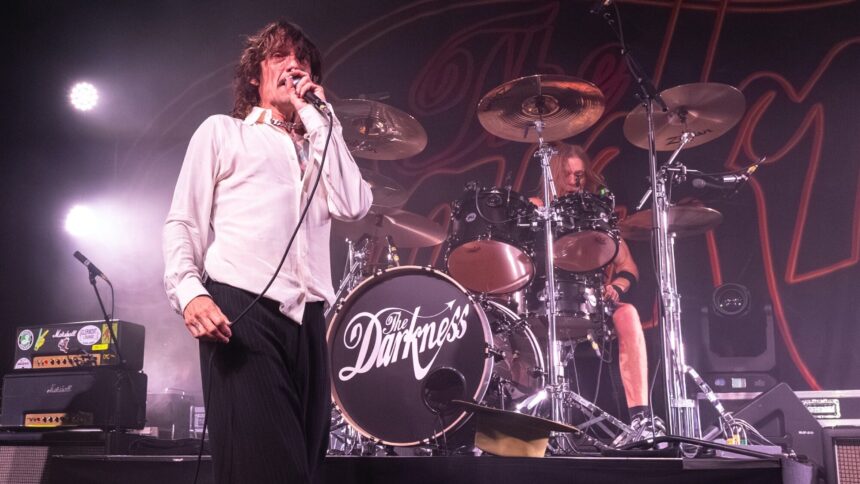 The Darkness. Justin Hawkins performs live with . Steve Jennings/Getty